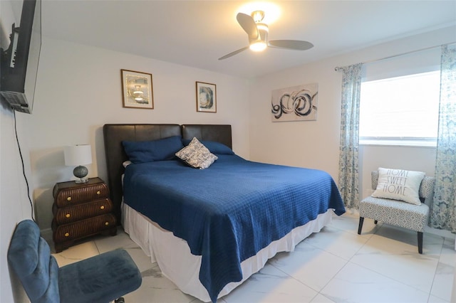 bedroom with a ceiling fan and marble finish floor