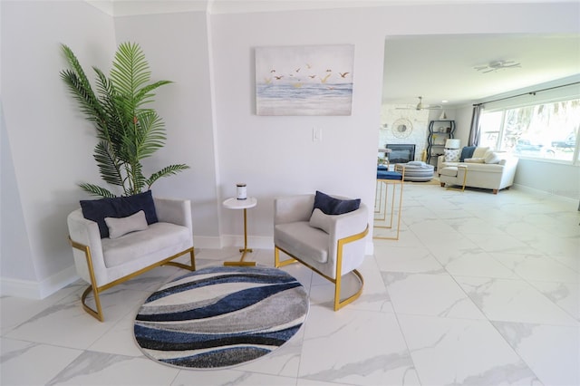 817 Blue Heron Blvd, Ruskin, FL 33570 - living area featuring light marble finish flooring, baseboards, and a large fireplace