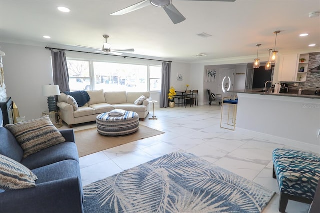817 Blue Heron Blvd, Ruskin, FL 33570 - living area with ceiling fan, light marble finish flooring, recessed lighting, and crown molding