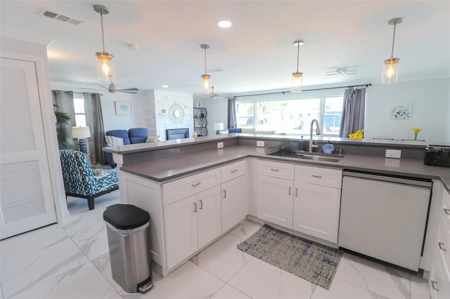 817 Blue Heron Blvd, Ruskin, FL 33570 - kitchen featuring white dishwasher, plenty of natural light, dark countertops, open floor plan, and recessed lighting