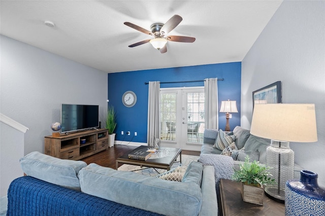 living room featuring french doors, baseboards, a ceiling fan, and wood finished floors