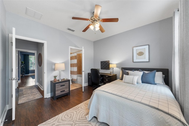 bedroom featuring ceiling fan, wood finished floors, visible vents, and baseboards