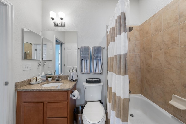 bathroom featuring toilet, shower / bath combo, and vanity