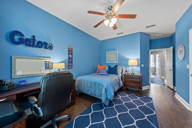 bedroom with dark wood finished floors, visible vents, and baseboards