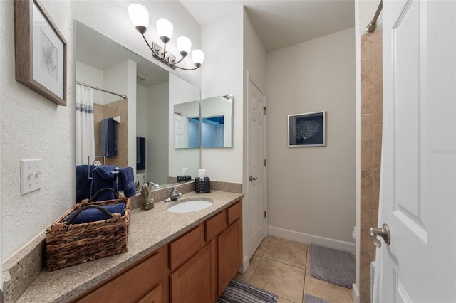 full bathroom with tile patterned flooring, curtained shower, vanity, and baseboards