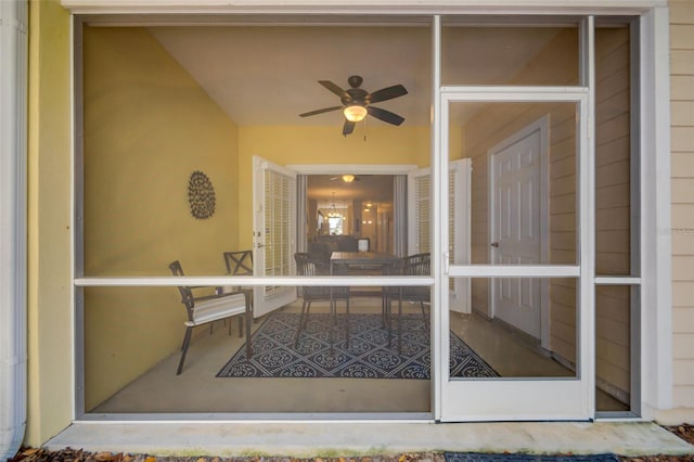 view of exterior entry with ceiling fan