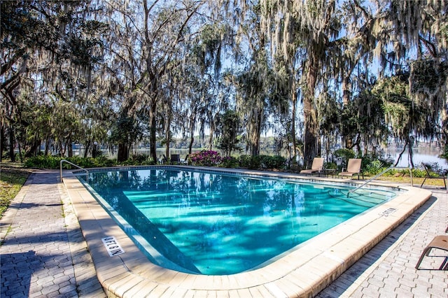 pool with a patio area