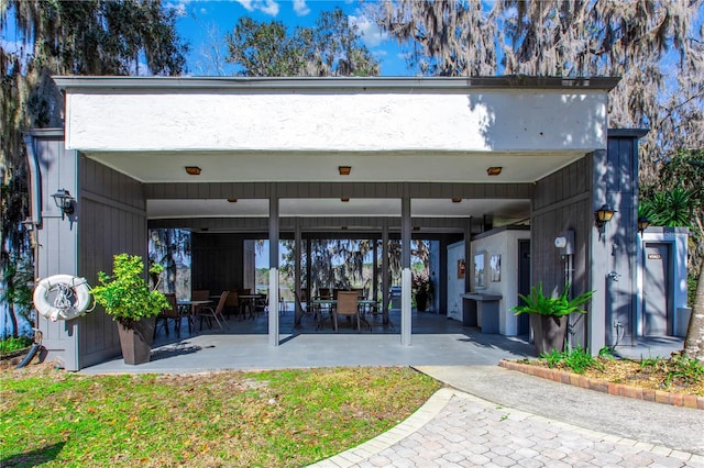 rear view of property featuring a patio area