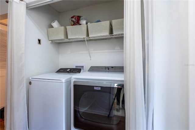 laundry area featuring laundry area and washer and clothes dryer