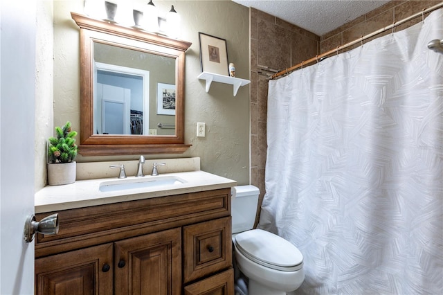 bathroom with a shower with curtain, toilet, a textured ceiling, vanity, and a textured wall