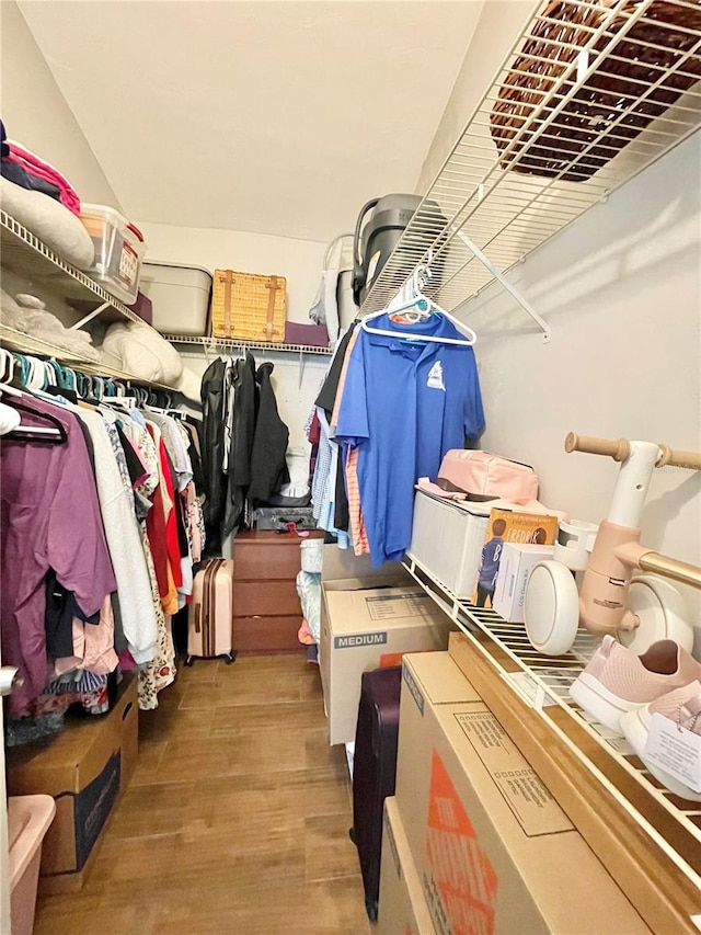 spacious closet with wood finished floors