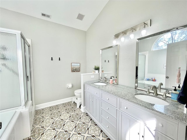 full bath featuring vaulted ceiling, visible vents, and a sink