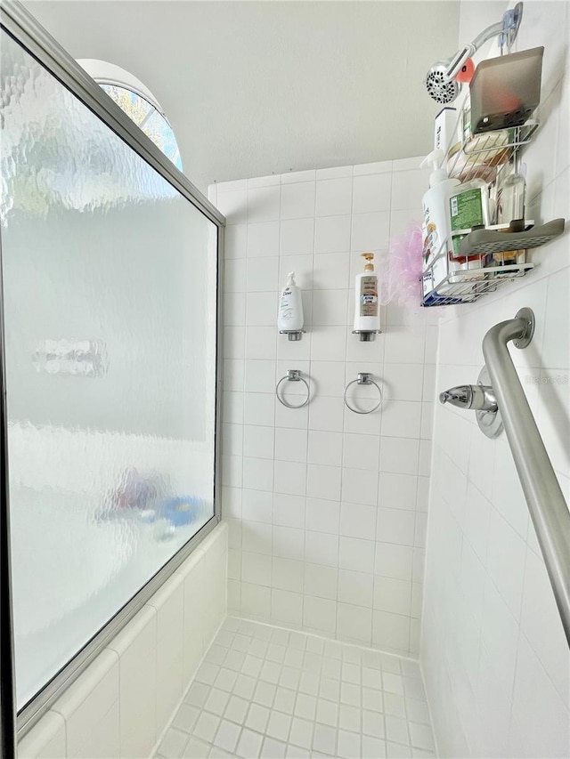 full bathroom with tiled shower