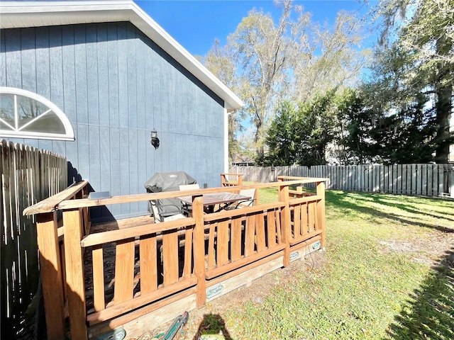 view of yard featuring a deck and a fenced backyard