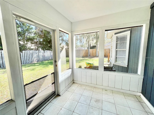 unfurnished sunroom featuring plenty of natural light