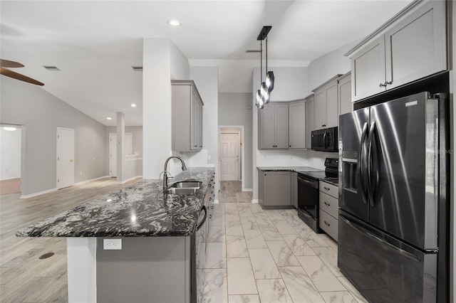 kitchen featuring a sink, visible vents, black appliances, and gray cabinets