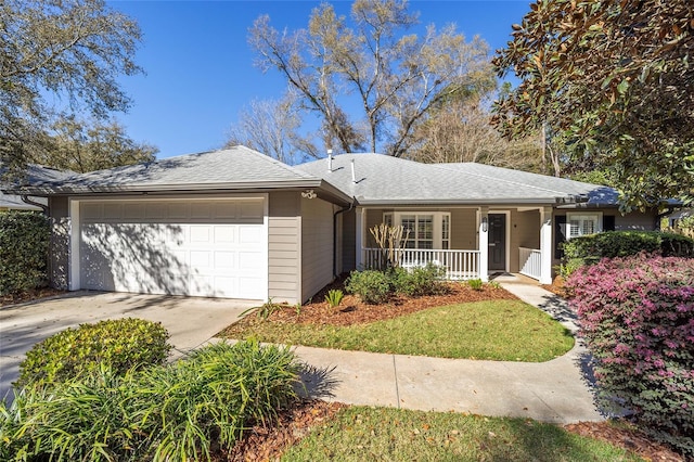 ranch-style home with an attached garage, covered porch, driveway, and a shingled roof