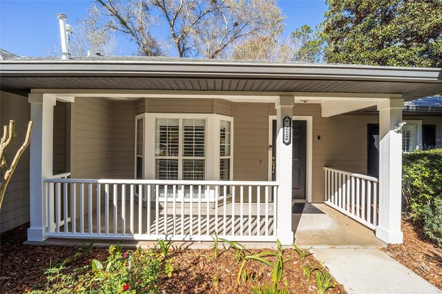 doorway to property with a porch