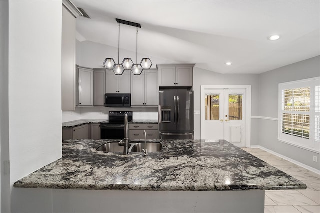 kitchen featuring fridge with ice dispenser, vaulted ceiling, dark stone countertops, gray cabinets, and range with electric stovetop