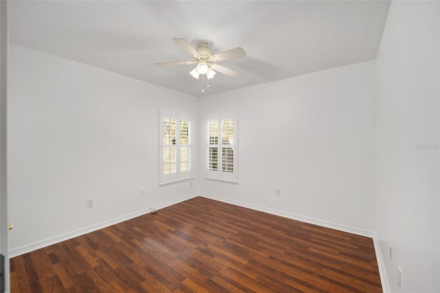 unfurnished room featuring a ceiling fan, wood finished floors, and baseboards