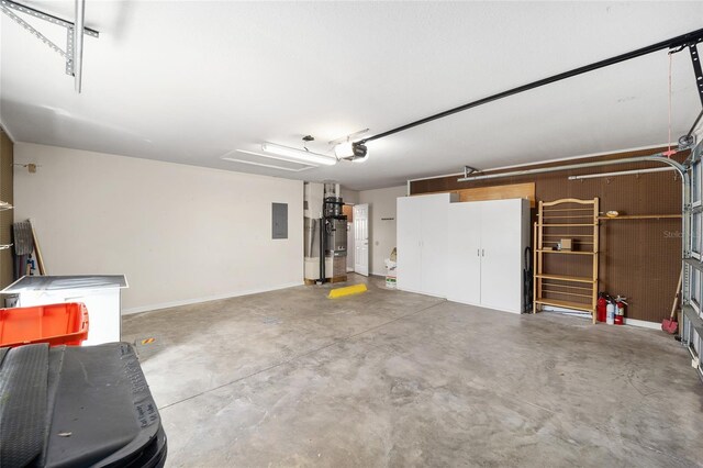 garage featuring electric panel and a garage door opener