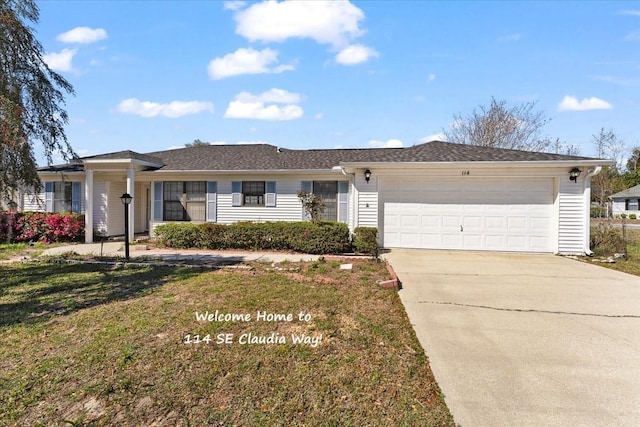 single story home with an attached garage, driveway, and a front yard