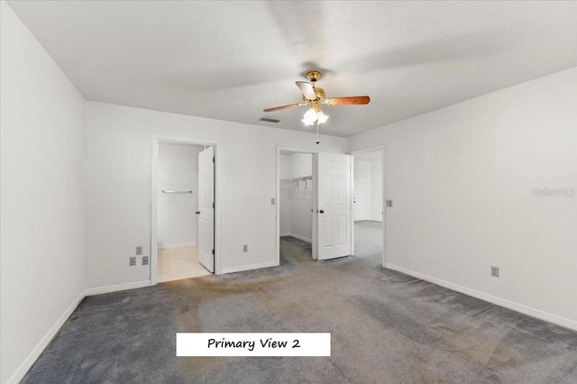 unfurnished bedroom with visible vents, carpet floors, and baseboards