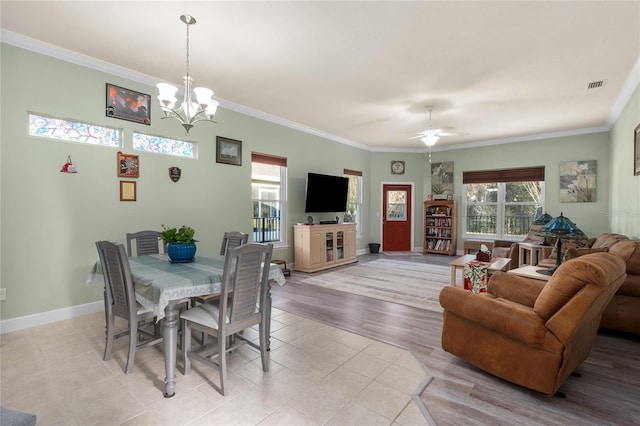 dining space featuring visible vents, baseboards, and ornamental molding