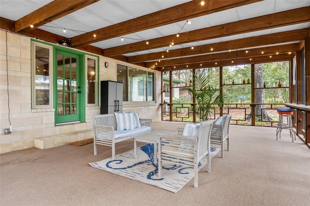 sunroom with beam ceiling