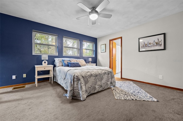 bedroom with a ceiling fan, carpet, visible vents, and baseboards