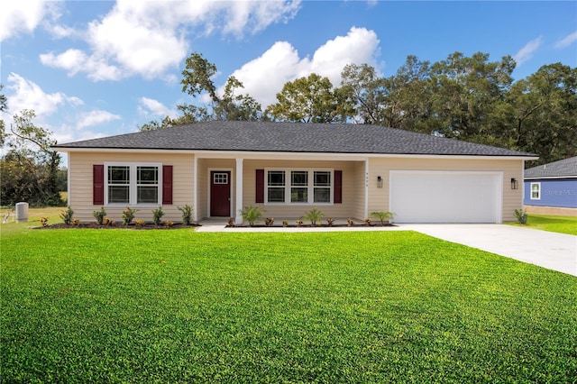 ranch-style house with a garage, concrete driveway, and a front lawn