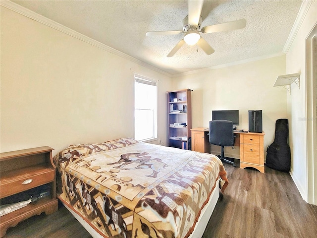 bedroom featuring ceiling fan, ornamental molding, wood finished floors, and a textured ceiling