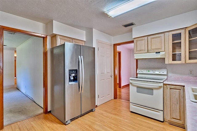 kitchen featuring stainless steel fridge with ice dispenser, under cabinet range hood, light wood-type flooring, light countertops, and white electric range oven