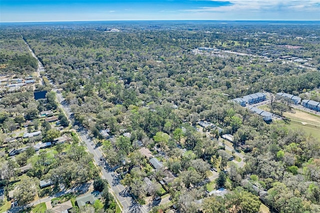 drone / aerial view with a view of trees