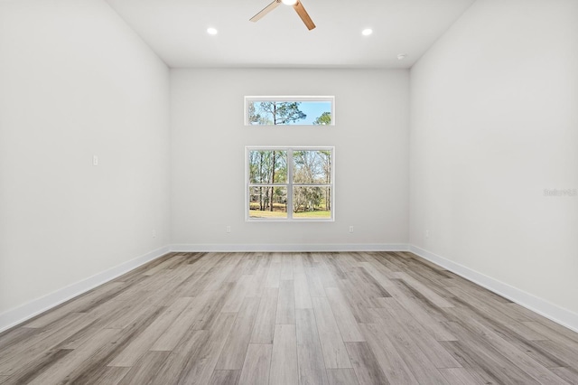 empty room featuring recessed lighting, light wood-style flooring, baseboards, and ceiling fan