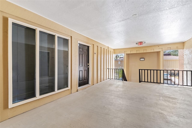 view of patio featuring a balcony