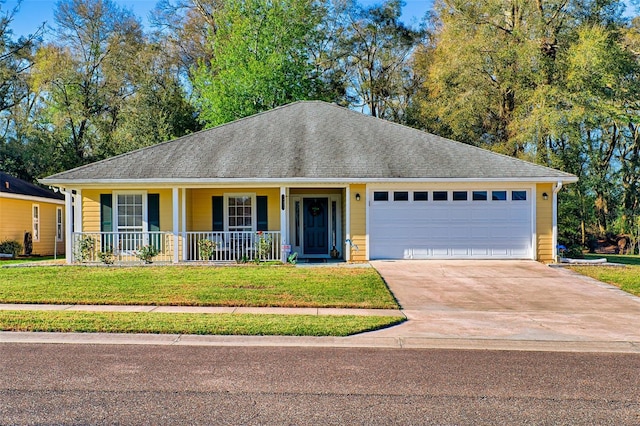 ranch-style home featuring a front yard, roof with shingles, a porch, an attached garage, and concrete driveway