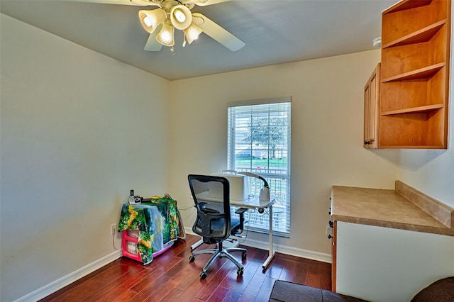 home office featuring baseboards, a ceiling fan, and dark wood-style flooring