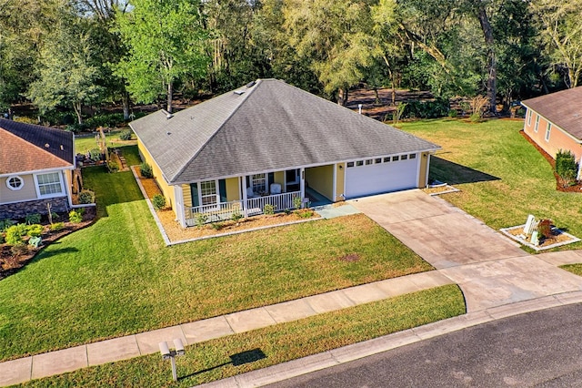 view of front of home featuring driveway, roof with shingles, a porch, an attached garage, and a front lawn