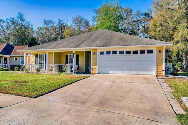 ranch-style home with a porch, a front yard, a garage, and driveway