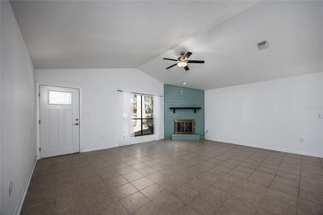 unfurnished living room with vaulted ceiling, a fireplace, baseboards, and ceiling fan