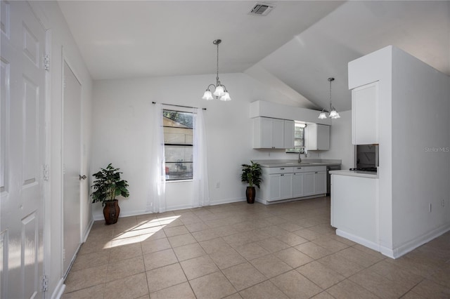 kitchen with visible vents, lofted ceiling, a chandelier, and white cabinets