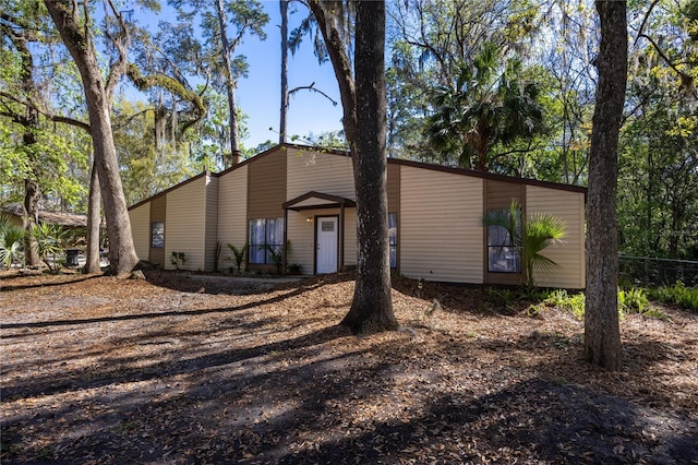 mid-century inspired home with a chimney