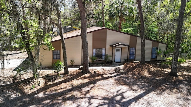 mid-century home with a forest view