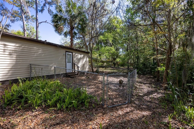 view of yard featuring a gate and fence