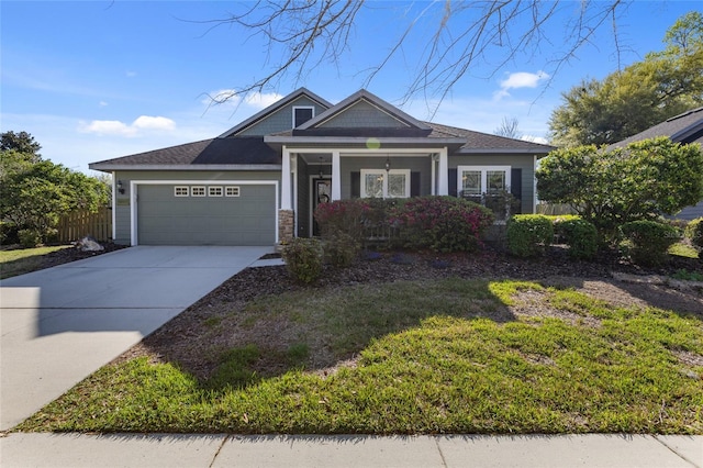 view of front of property featuring concrete driveway, fence, a garage, and stone siding