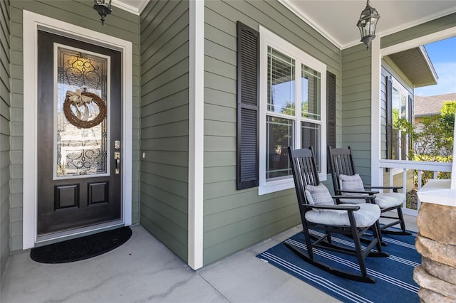 doorway to property featuring covered porch