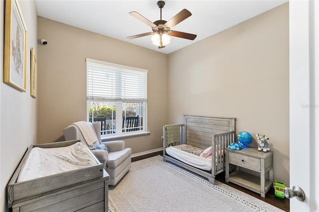 bedroom with baseboards and ceiling fan