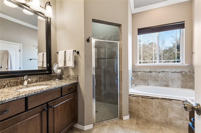 full bathroom featuring vanity, a shower stall, a bath, and ornamental molding