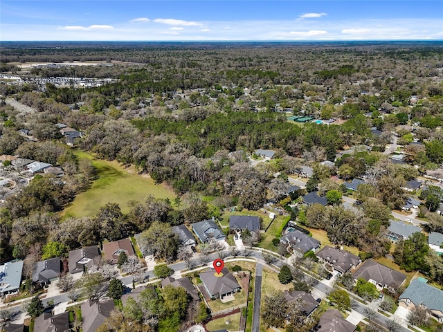 bird's eye view with a residential view and a wooded view